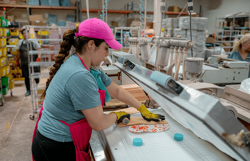 Worker creating a custom orthotics for people with diabetes who need custom footwear for specific foot conditions.