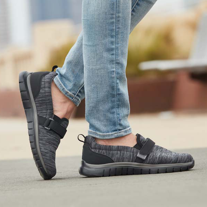 Portland (Stark), Oregon located on Stark Street person wearing diabetic black and gray footwear outside